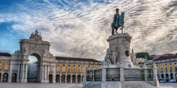 Lisbon, Portugal: the Triumphal Rua Augusta Arch, Arco Triunfal da Rua Augusta, Praca do Comercio and Statue of King Jose I at sunrise