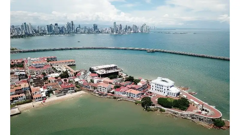 Aerial view of Casco Viejo, the waterfront, and Panama City’s modern skyline.