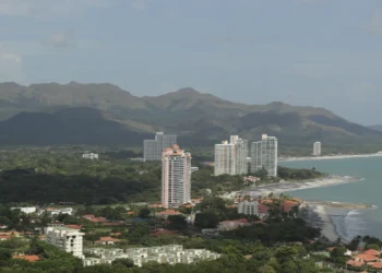 Aerial view of Coronado Beach Panama coastline with Pacific Ocean waves and beachfront resort condominiums.