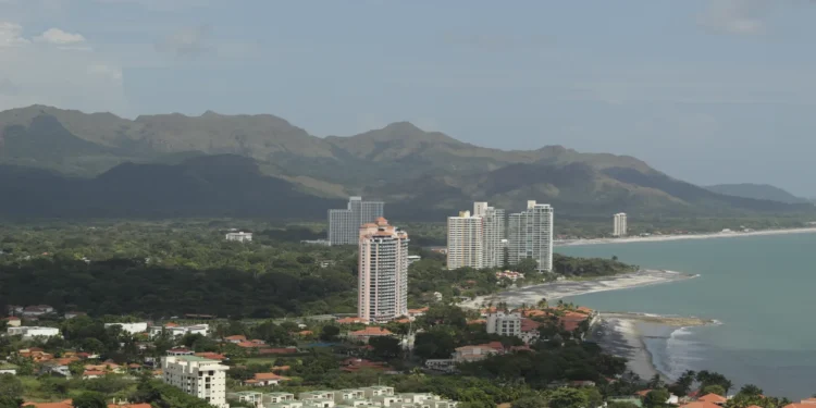 Aerial view of Coronado Beach Panama coastline with Pacific Ocean waves and beachfront resort condominiums.