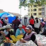 Indigenous women barter at the market.
