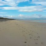 Blue skies on a beach in Ireland.