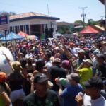 Revelers being sprayed by a water truck during carnival in Las Tablas, Panama.