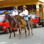 Cowboys ride through the streets of Las Tablas, Panama.