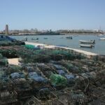 Lobster traps piled on the wharf in Portugal.