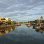 Fishing boats moor up a river mouth in Vietnam.