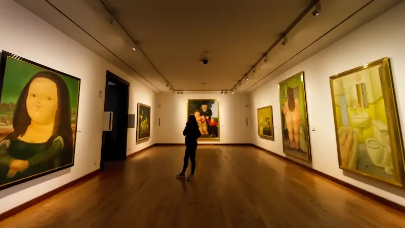 Female visitor looks at Botero's version of Da Vinci's Mona Lisa, Bogota, Colombia