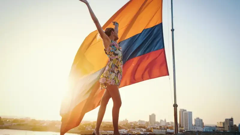 colombian flag and girl in golden and optimist sunshine full of patriot