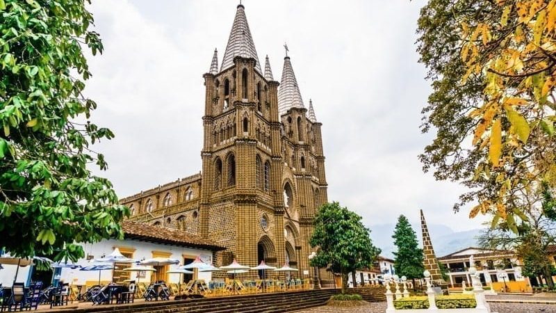 View of church and main square in colonial city El Jardin, Medellin, live in Colombia