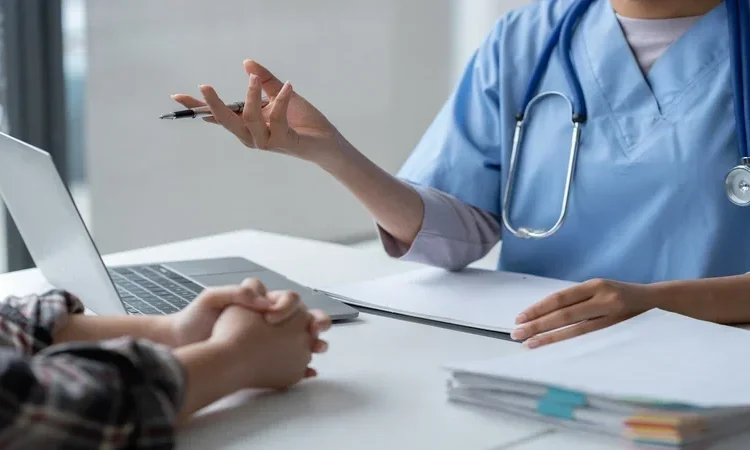 Female doctor using a stethoscope to examine a patient, asks for information,. health care in david