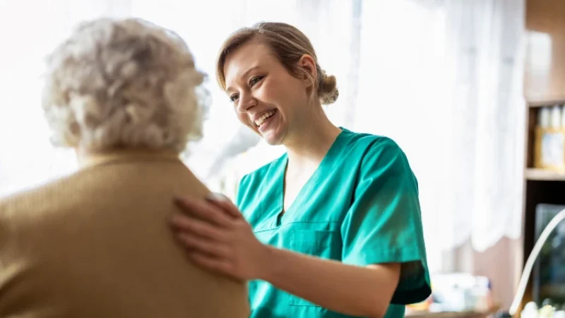 Friendly nurse supporting an elderly lady. limassol