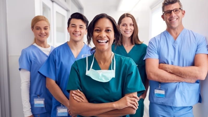 Medical Team Standing In Hospital Corridor