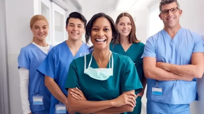 Medical Team Standing In Hospital Corridor