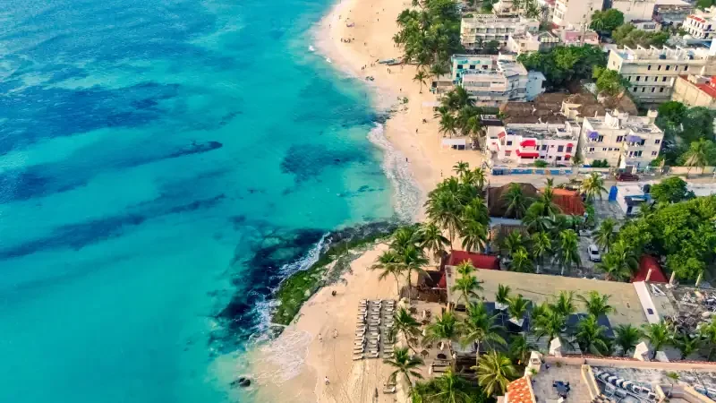 Aerial view of Playa del Carmen, Mexico, with turquoise waters and reefs